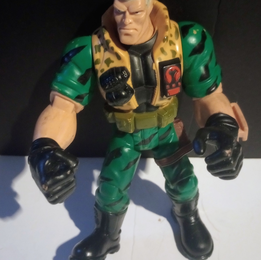 Green and Black Action Figure